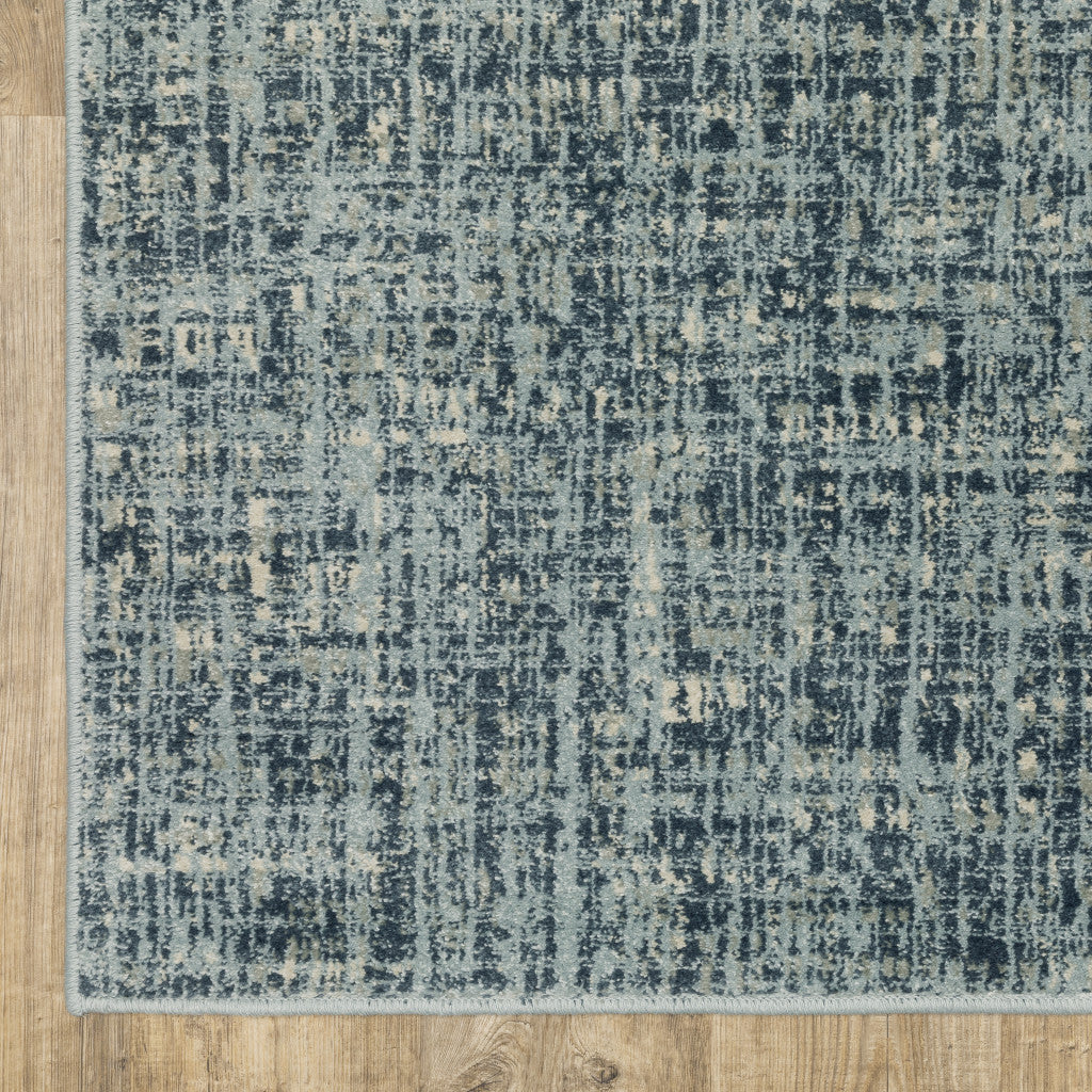 5' X 7' Dark Blue Light Blue Grey Ivory And Beige Abstract Power Loom Stain Resistant Area Rug