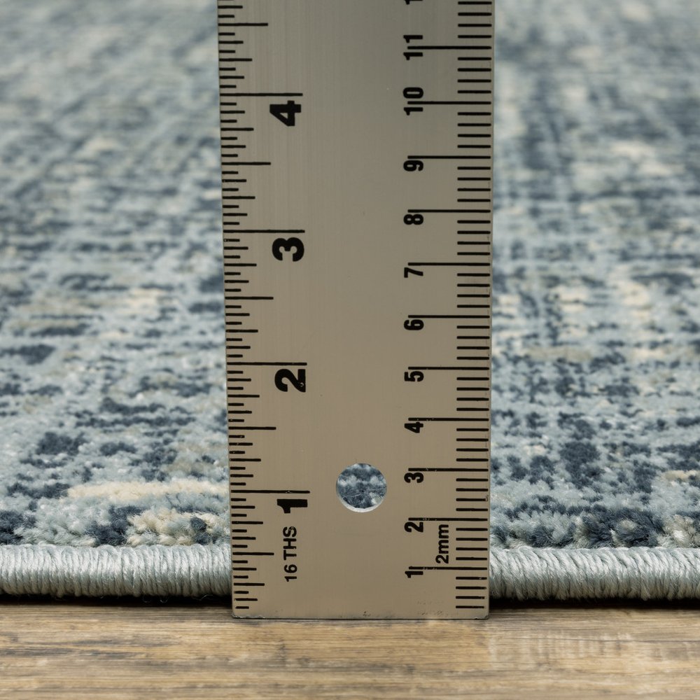 7' X 9' Blue And Beige Abstract Area Rug