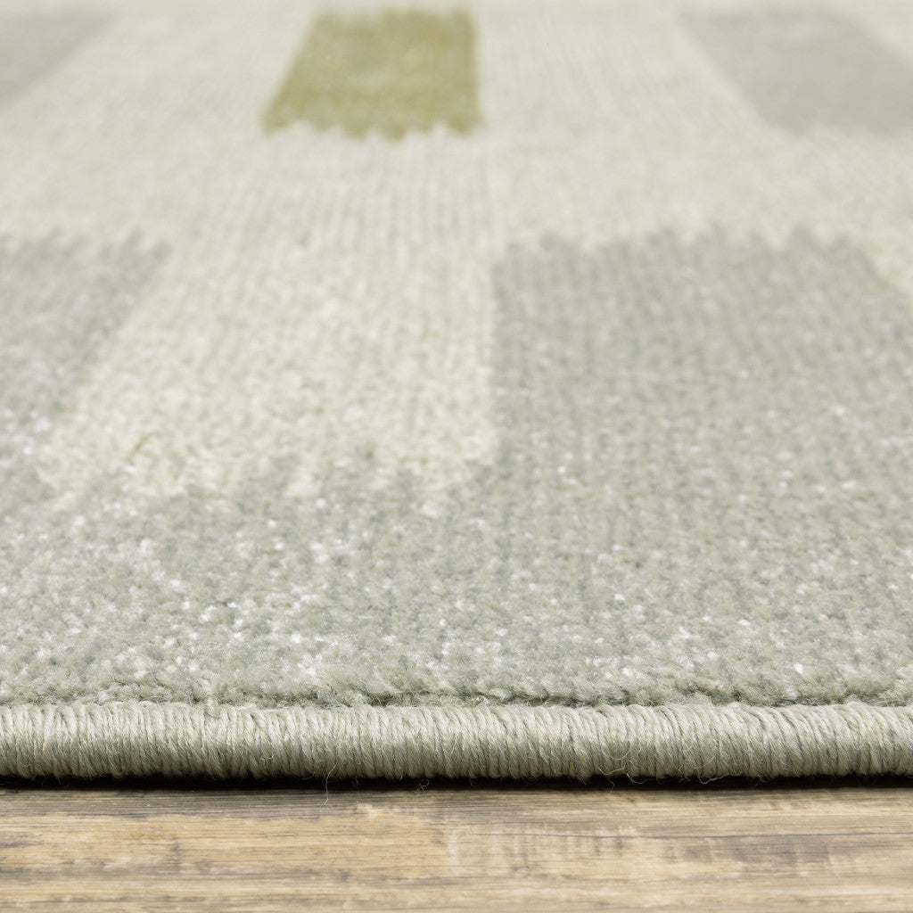 5' X 7' Beige Grey Gold And Green Geometric Power Loom Stain Resistant Area Rug