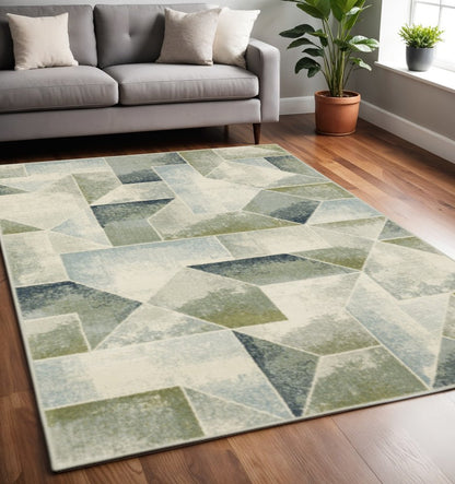 5' X 7' Blue Green Grey Gold And Ivory Geometric Power Loom Stain Resistant Area Rug