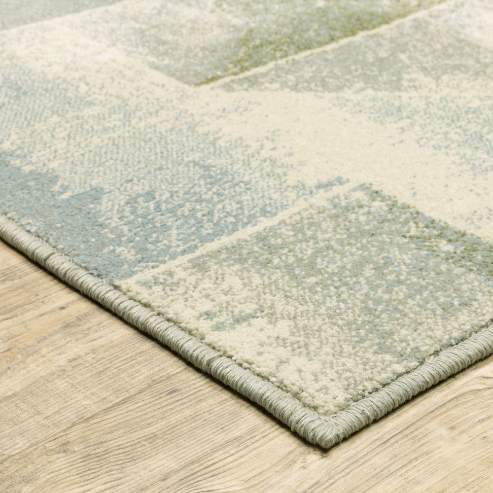 10' x 13' Blue Green Grey Gold and Ivory geometric power loom stain resistant area rug