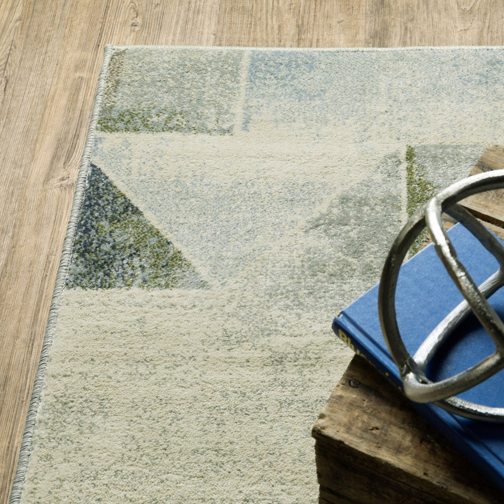 10' x 13' blue, green, grey, gold and ivory geometric power loom stain resistant area rug