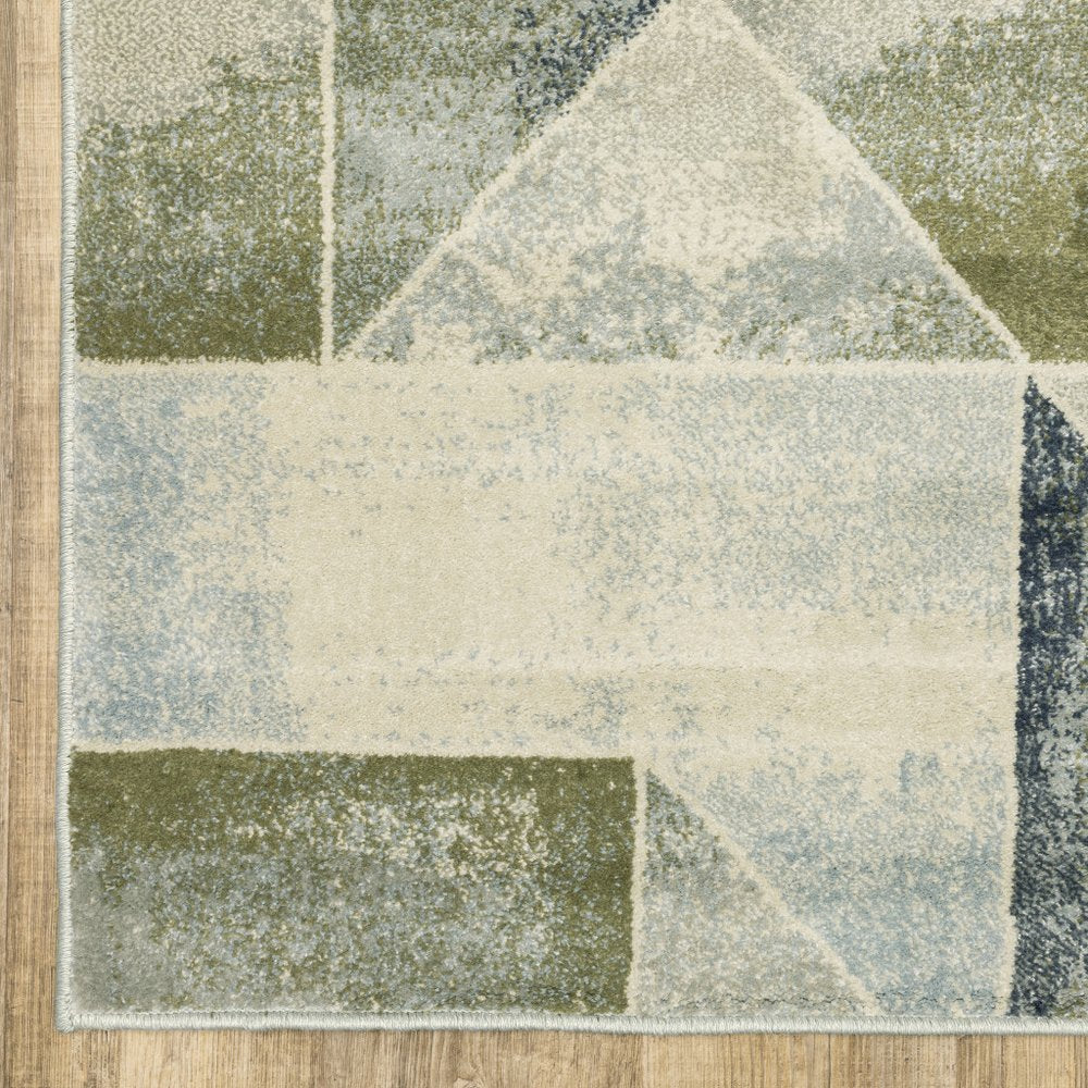 10' x 13' blue, green, grey, gold and ivory geometric power loom area rug, stain resistant.