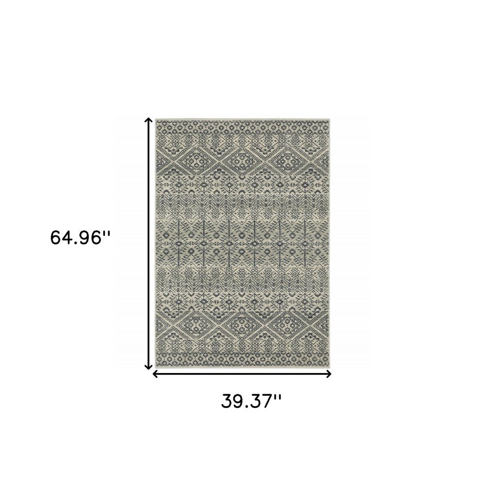 Blue and beige geometric, power-loomed area rug, 3' X 5', stain resistant.