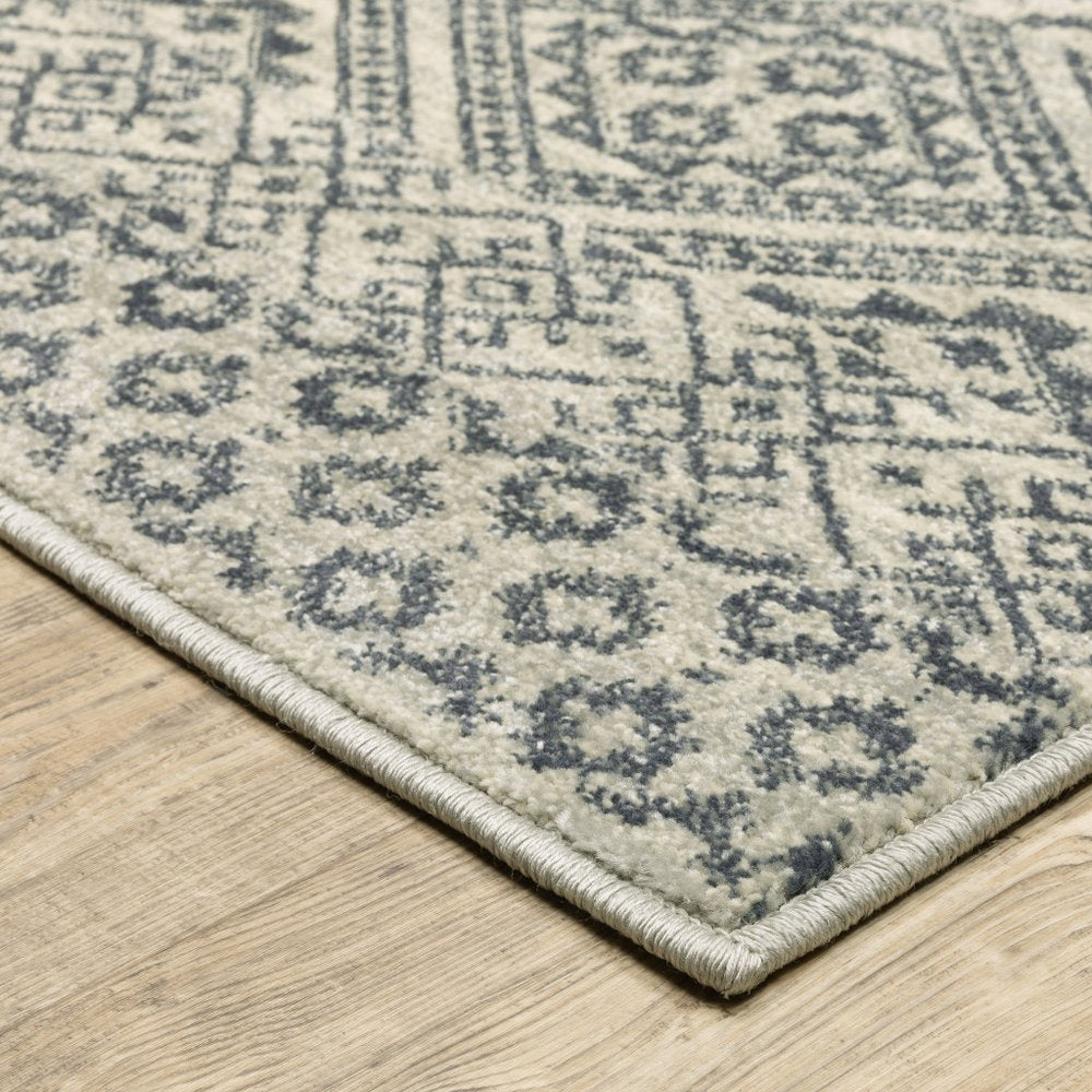7' X 9' Blue And Beige Geometric Area Rug