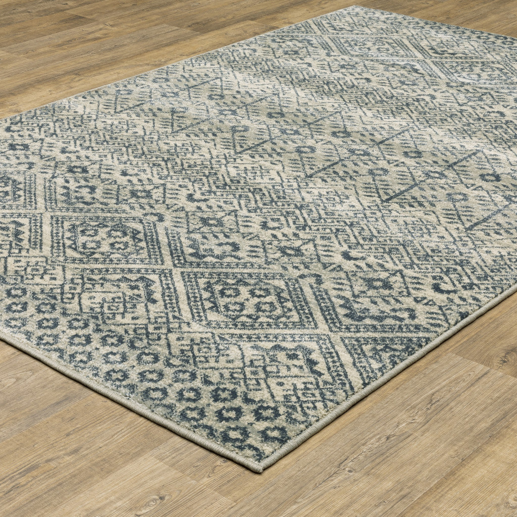 6' X 9' Blue And Beige Geometric Power Loom Stain Resistant Area Rug