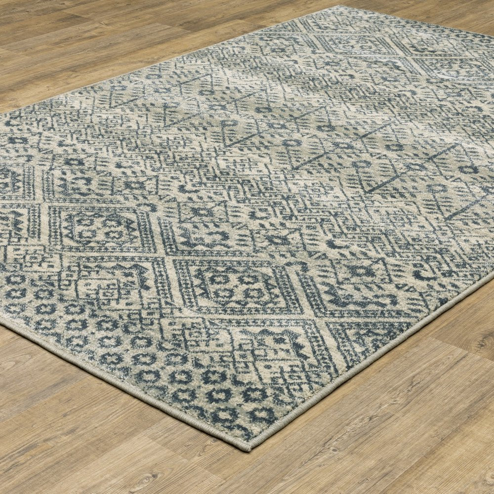 7' X 9' Blue And Beige Geometric Area Rug