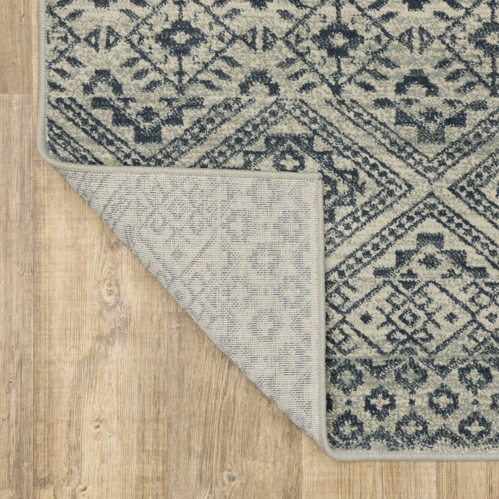 7' X 9' Blue And Beige Geometric Area Rug