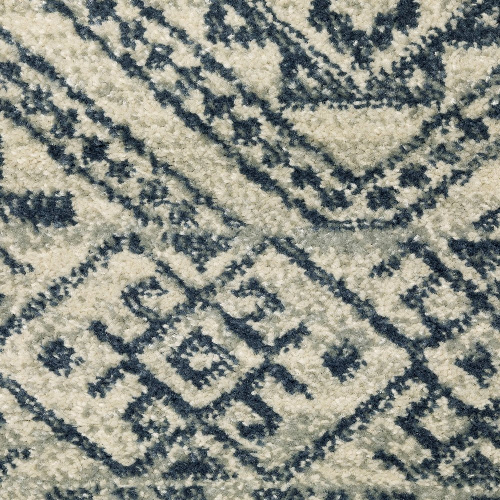 7' X 9' Blue And Beige Geometric Area Rug