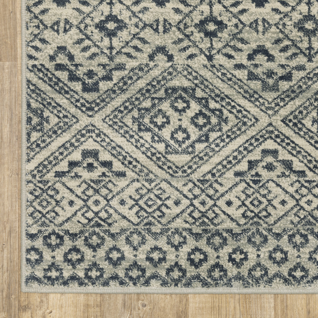 6' X 9' Blue And Beige Geometric Power Loom Stain Resistant Area Rug