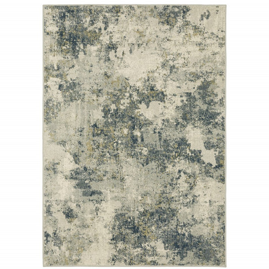 Abstract beige area rug with teal, grey and gold mottled pattern, modern distressed look.