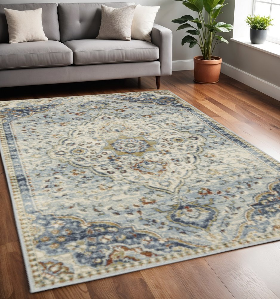5' x 7' blue beige rust gold and teal Oriental power loom stain-resistant area rug