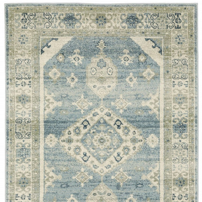 Blue and ivory distressed oriental rug with central medallion and floral border, ideal for living rooms.