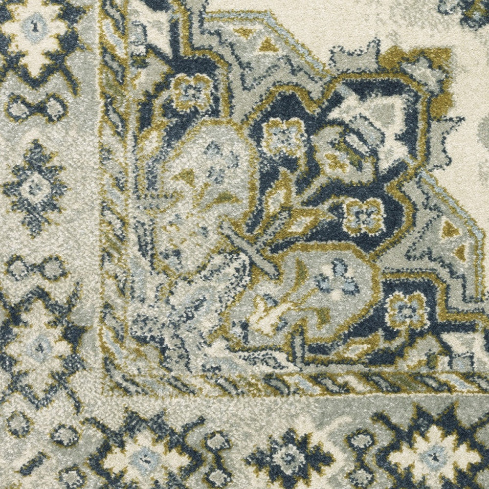 6' X 9' Ivory Blue Teal Grey And Olive Green Oriental Power Loom Stain Resistant Area Rug