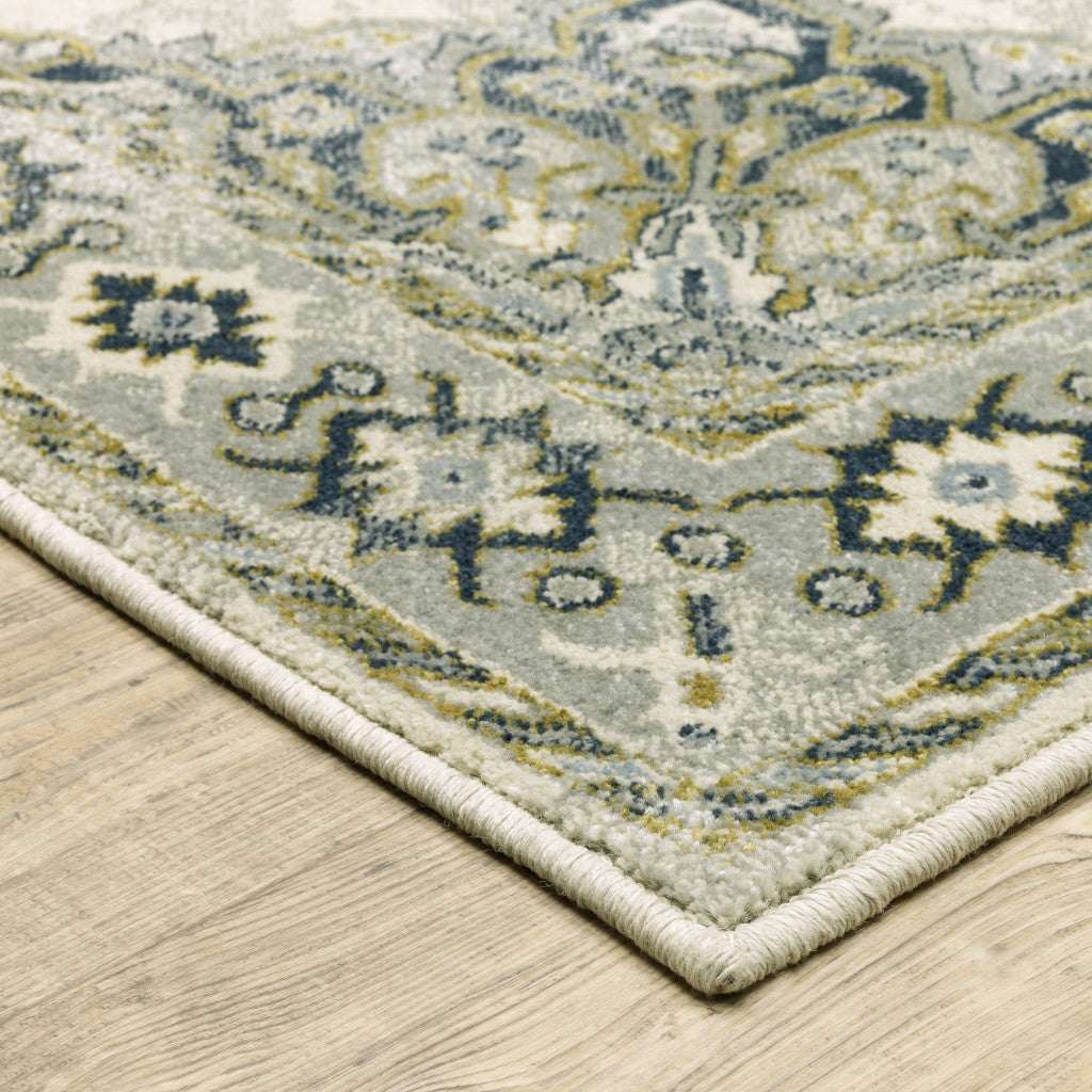 6' X 9' Ivory Blue Teal Grey And Olive Green Oriental Power Loom Stain Resistant Area Rug