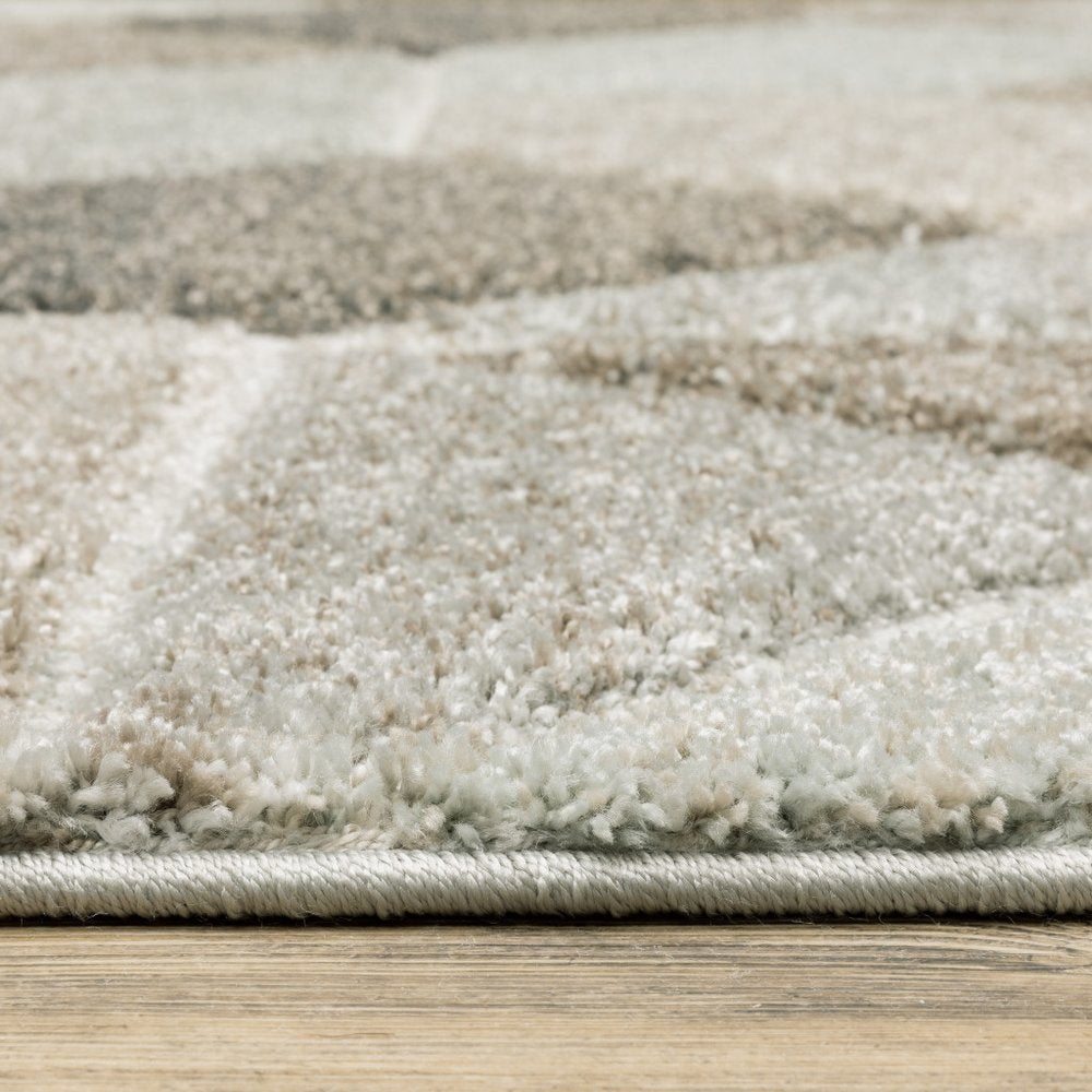 2' x 8' geometric runner rug in grey, brown, beige, tan, taupe and ivory; power loom construction and stain resistant.
