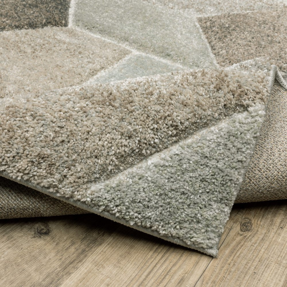 2' x 8' geometric runner rug in grey, brown, beige, taupe and ivory; power-loomed and stain resistant.