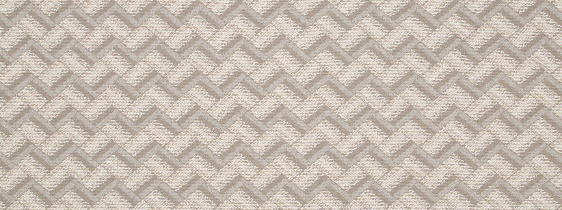 Neutral beige and taupe upholstery fabric with a repeating chevron diamond pattern and soft textured weave.
