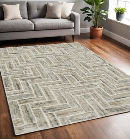 5' X 8' Ivory Beige Grey Brown Pale Blue And Charcoal Geometric Power Loom Stain Resistant Area Rug
