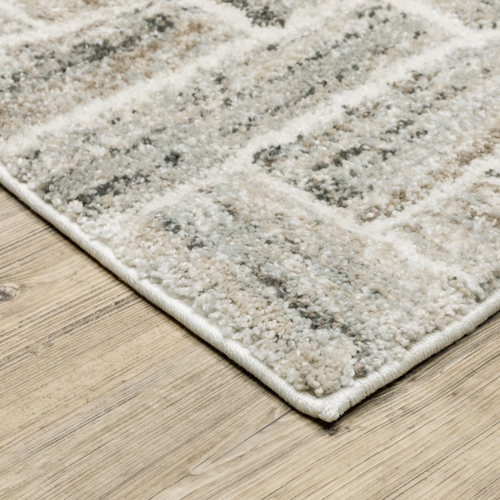 7' X 10' Ivory And Beige Geometric Area Rug