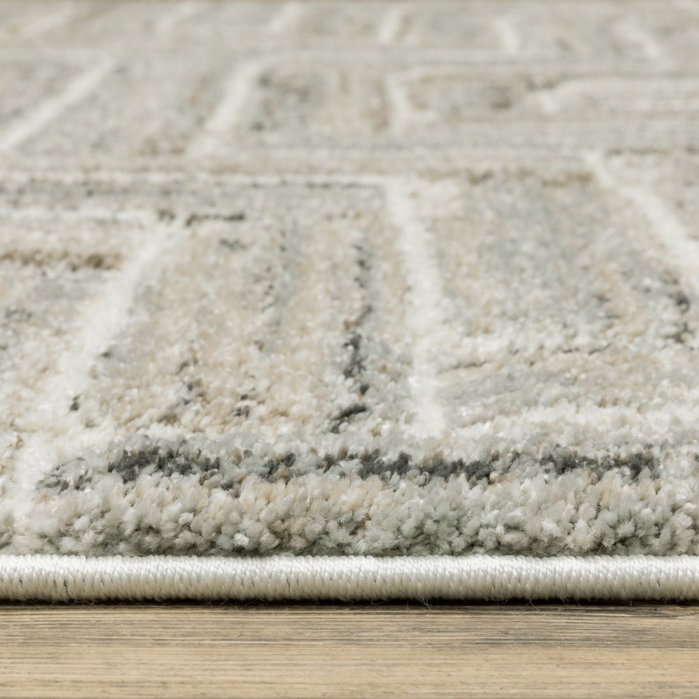 7' X 10' Ivory And Beige Geometric Area Rug
