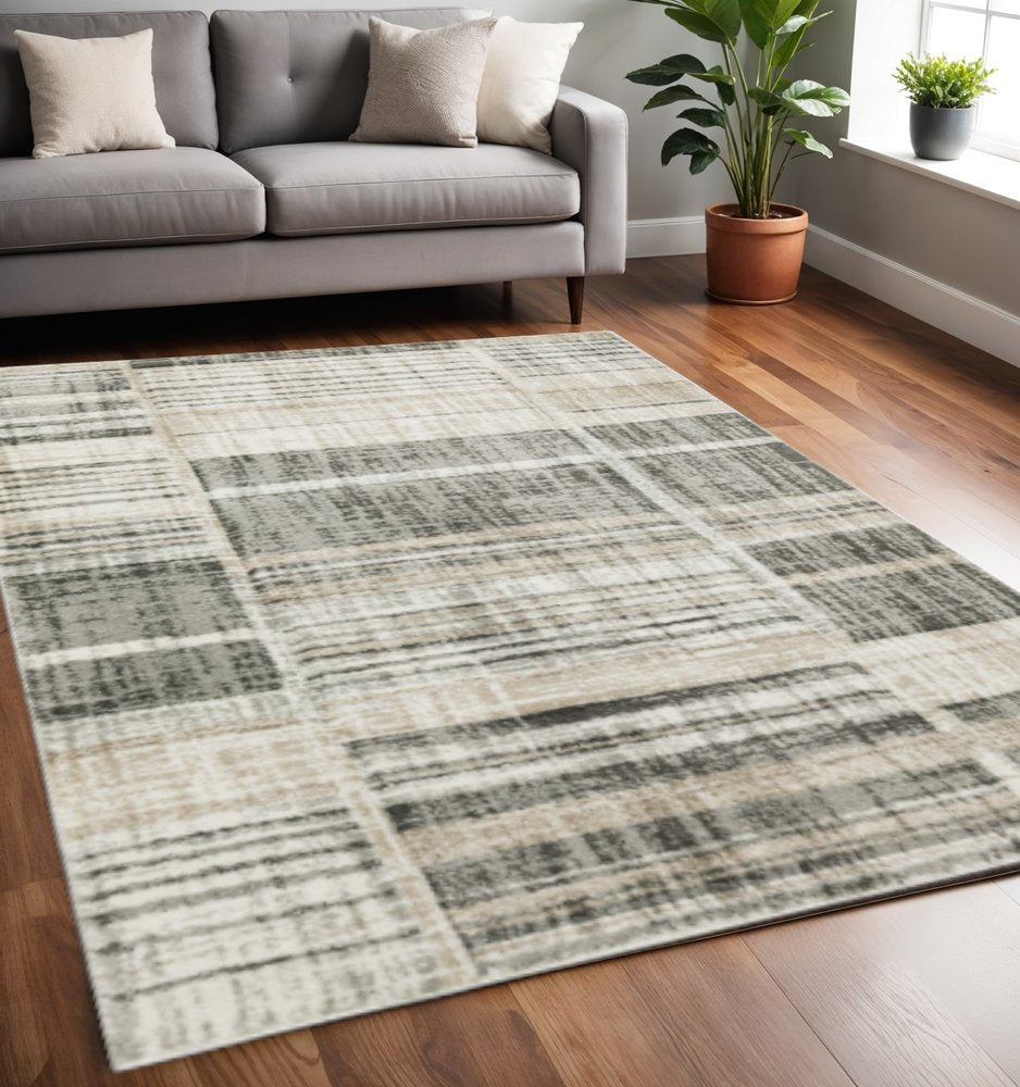 5' X 8' Grey Charcoal Ivory Tan Brown And Beige Geometric Power Loom Stain Resistant Area Rug