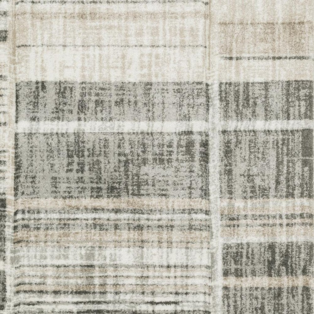 5' X 8' Grey Charcoal Ivory Tan Brown And Beige Geometric Power Loom Stain Resistant Area Rug