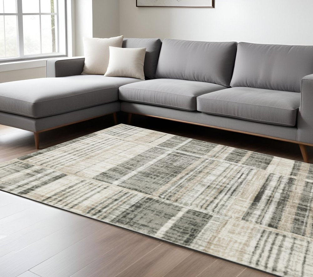 6' X 9' Grey Charcoal Ivory Tan Brown And Beige Geometric Power Loom Stain Resistant Area Rug