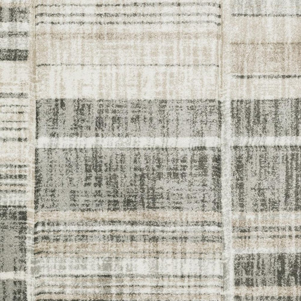 6' X 9' Grey Charcoal Ivory Tan Brown And Beige Geometric Power Loom Stain Resistant Area Rug