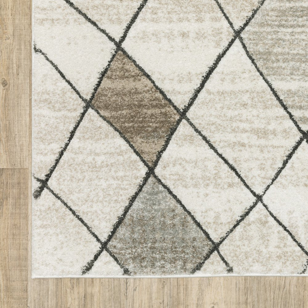 2' x 8' beige, grey, tan and brown geometric runner rug; power loom construction; stain resistant.
