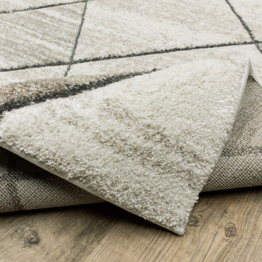 2' x 8' beige, grey, tan and brown geometric runner rug, power-loomed and stain resistant.