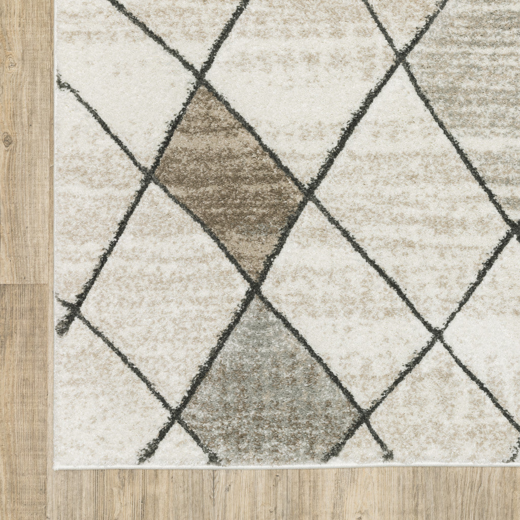 3' X 5' Beige Grey Tan And Brown Geometric Power Loom Stain Resistant Area Rug