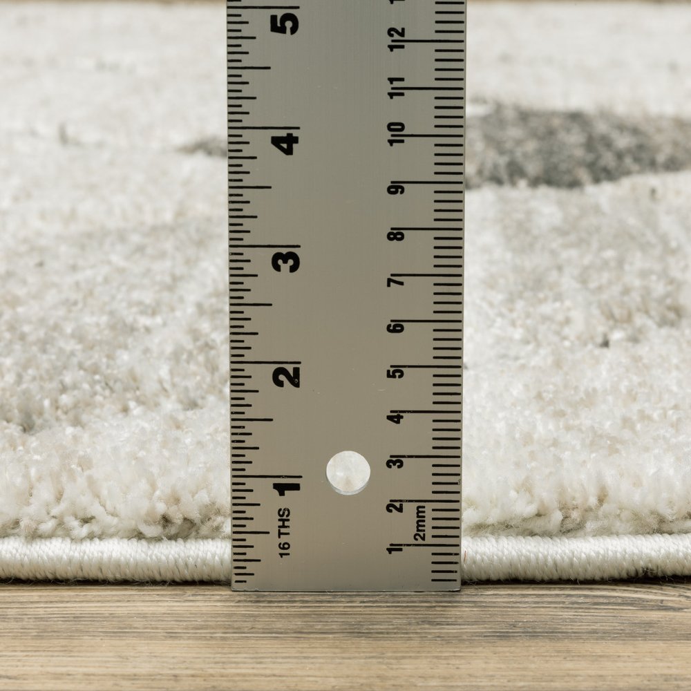 7' X 10' Beige And Gray Geometric Area Rug