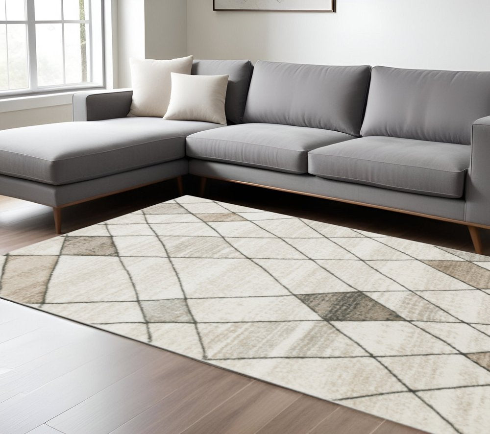 10' X 13' Beige Grey Tan And Brown Geometric Power Loom Stain Resistant Area Rug