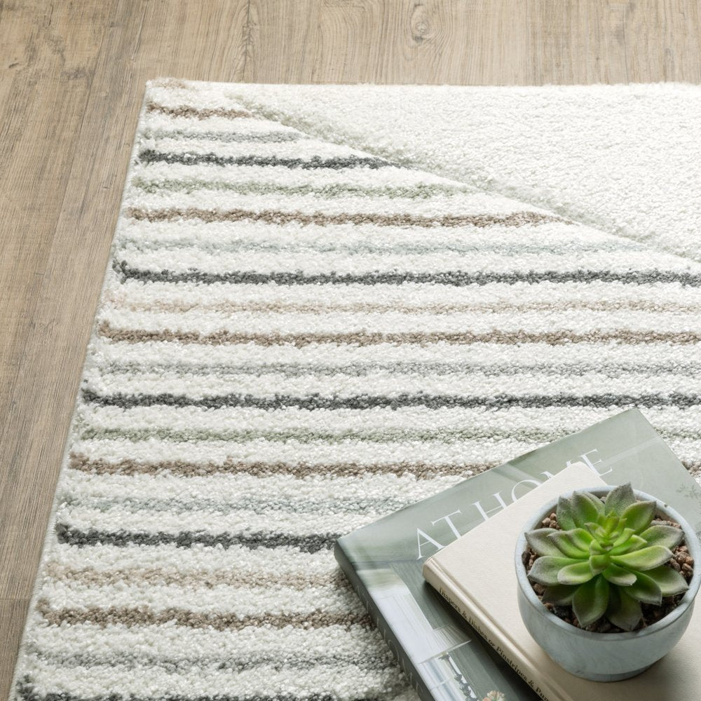 10' x 13' beige, grey, sage green, pale blue, brown and charcoal geometric power loom stain-resistant area rug