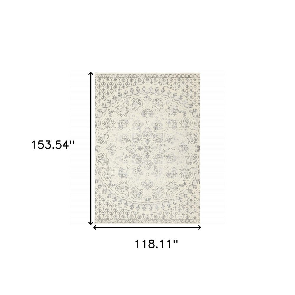 10' x 13' ivory and grey floral power loom stain resistant area rug