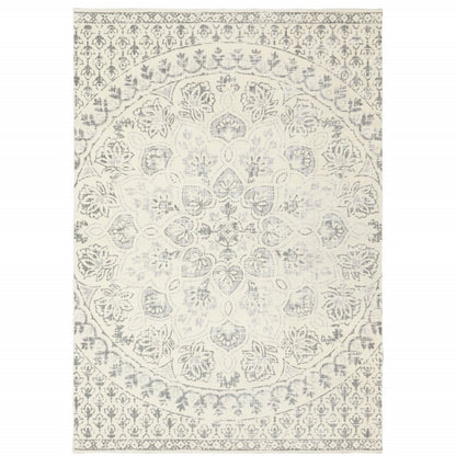 10' X 13' Ivory And Grey Floral Power Loom Stain Resistant Area Rug