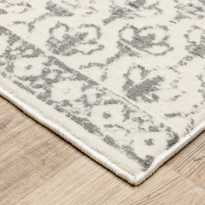10' x 13' ivory and grey floral power loom area rug; stain resistant.
