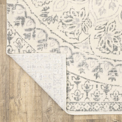 10' X 13' Ivory and Grey floral power loom stain-resistant area rug