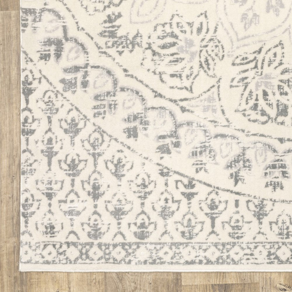 10' x 13' ivory and grey floral power loom stain resistant area rug