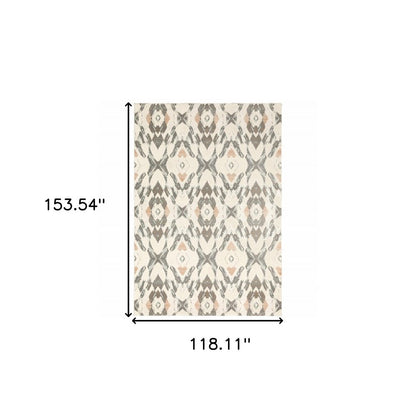 Rectangular area rug with geometric pattern in ivory, pink and sage; approx 118x154 inches