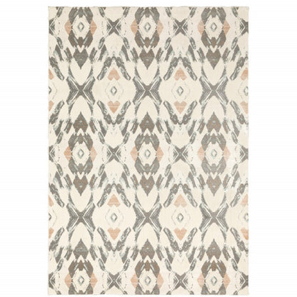 Geometric area rug in ivory, pink and sage with diamond motifs.