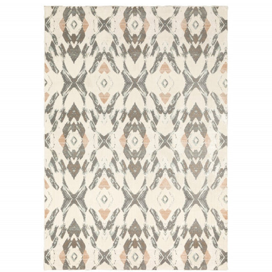 Geometric area rug in ivory, pink and sage with diamond motifs.