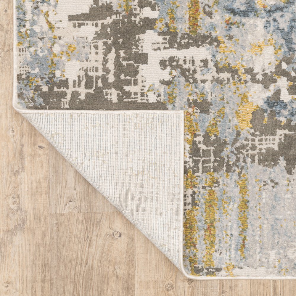 7' X 10' Beige And Blue Abstract Area Rug