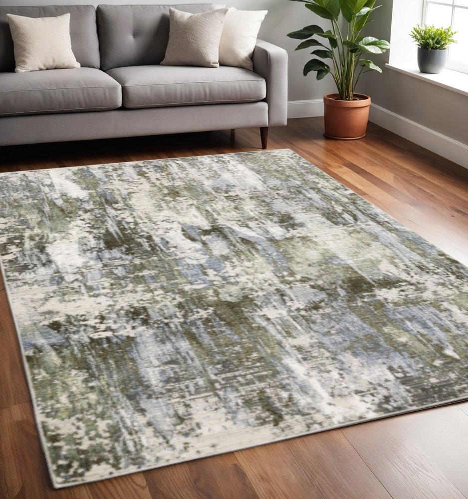5' X 8' Green Blue Grey Ivory And Brown Abstract Power Loom Stain Resistant Area Rug