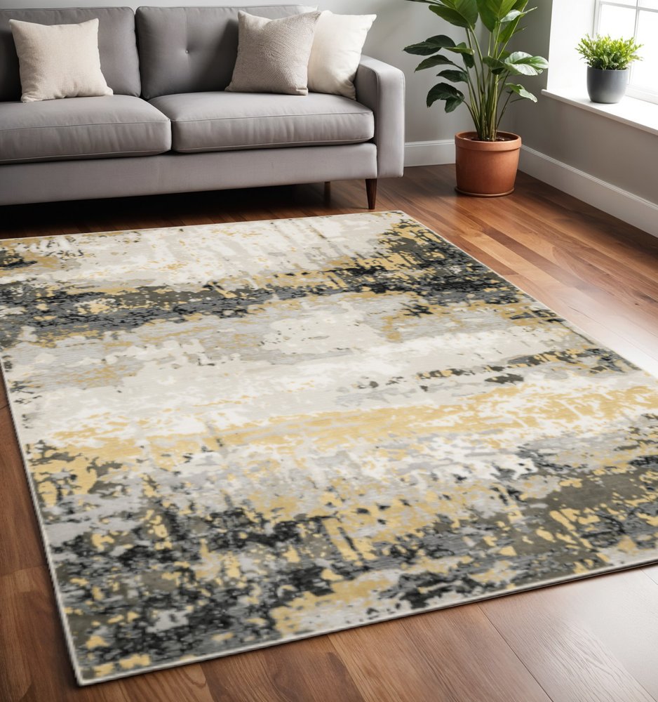 5' X 8' Grey Gold Beige Black And Brown Abstract Power Loom Stain Resistant Area Rug