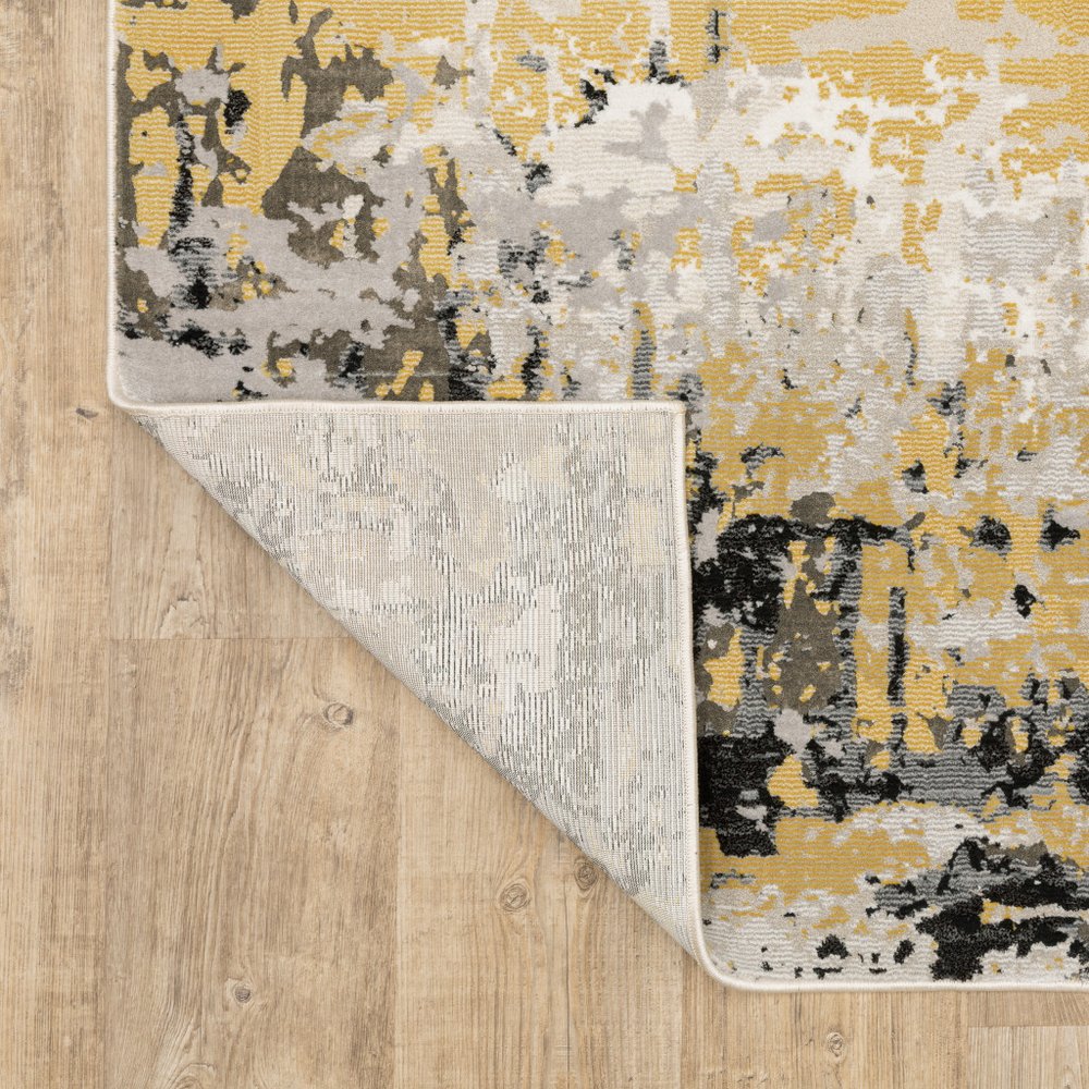 7' X 10' Beige And Gold Abstract Distressed Area Rug