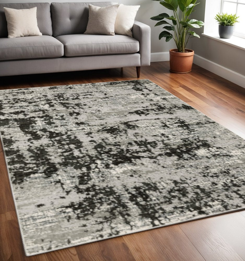 5' X 8' Grey Charcoal Black And Ivory Abstract Power Loom Stain Resistant Area Rug