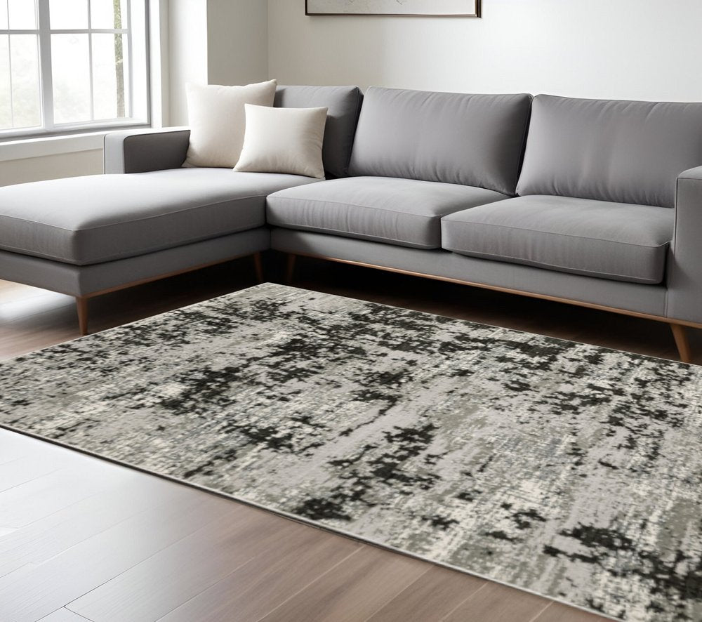 10' X 13' Grey Charcoal Black And Ivory Abstract Power Loom Stain Resistant Area Rug