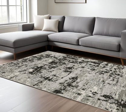 10' X 13' Grey Charcoal Black And Ivory Abstract Power Loom Stain Resistant Area Rug